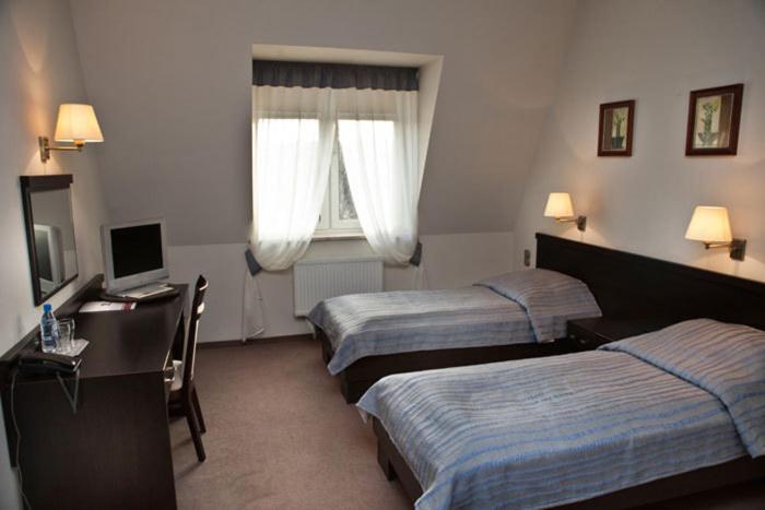 Portius Hotell Krosno Rom bilde